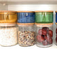 Glass storage jars set. Stackable glass jar, big clear + small color with natural wood. Small glass can be stackable on wooden.