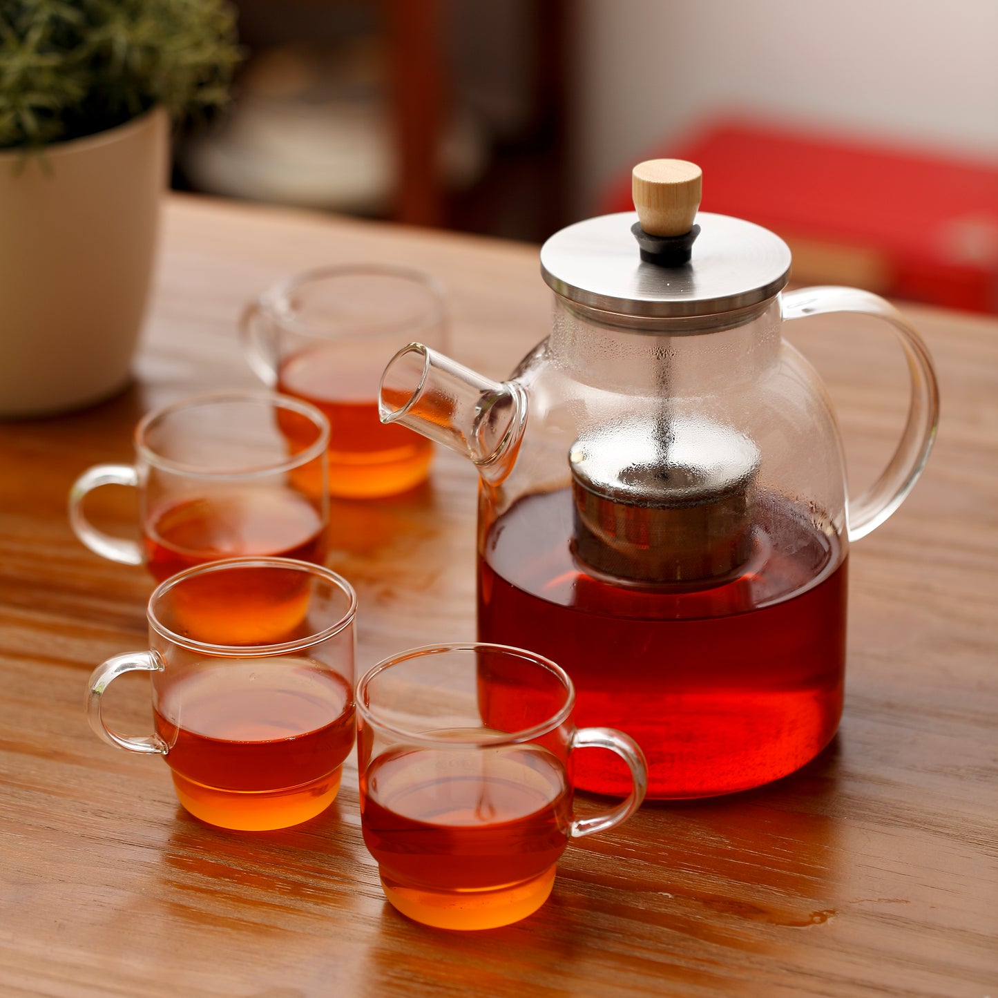 Heat resistant borosilicate glass 1.5L teapot with centered ss filter + foldable lift-up handle